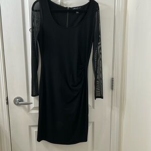 Kenneth Cole Dress
Stretchy Black 
Sheer Sleeves
Size 10
5 Star Seller